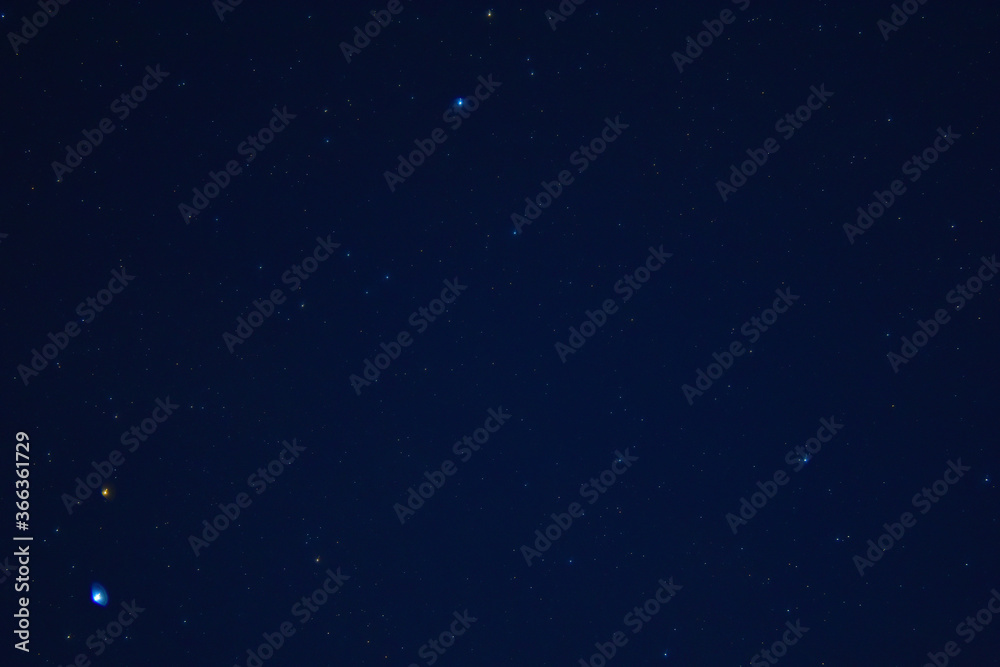 Fototapeta premium Starry sky in the village with noise in blue and black background