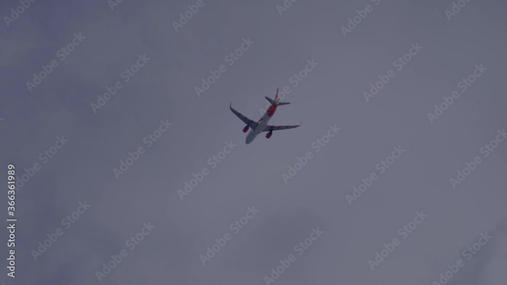Tracking shot of flying boeing airplane through clouds during beautiful summer day Tracking shot of flying boeing airplane through clouds during beautiful summer day