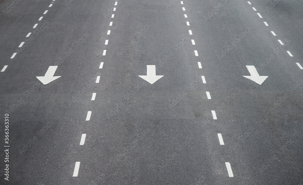 Directional signs. Arrows on the asphalt floor. Directional signs. Arrows on the asphalt floor.