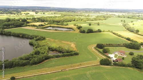 Aerial landscape view, Tonbridge, countryside, England, UK, Kent. Summer rural landscape. Rounded dron movement to the right.