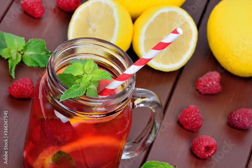 Raspberries lemonade in a jar
