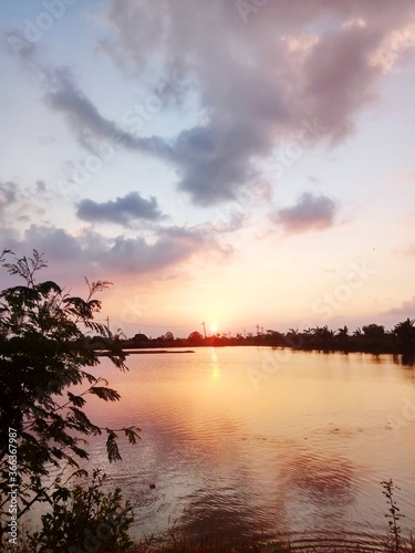 sunset over the lake © Abdmuid