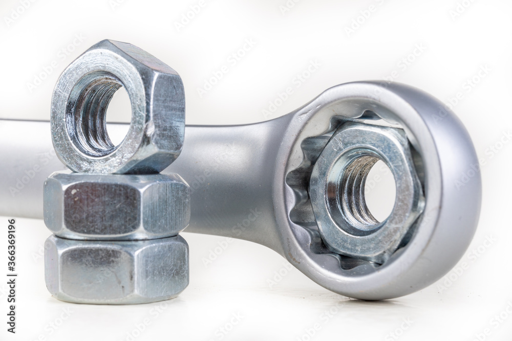 Wrench and metal nuts. Accessories for mounting metal elements.