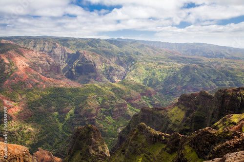 Waimea Canyon  on the Hawaiian island of Kauai  also known as the Grand Canyon of the Pacific  is a large canyon  approximately ten miles long and up to 3 000 feet deep.