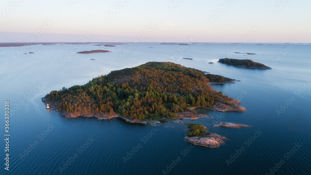 Aerial view over Archipelago Sea National Park Saaristomeri. Beautiful sunset sky. Finland.