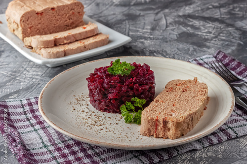 Fresh chicken terrine with beetroot confiture and parsley on a platter photo