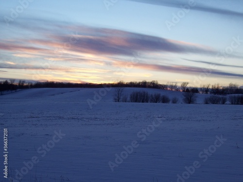 Rural Minnesota snowy fields at sunset 