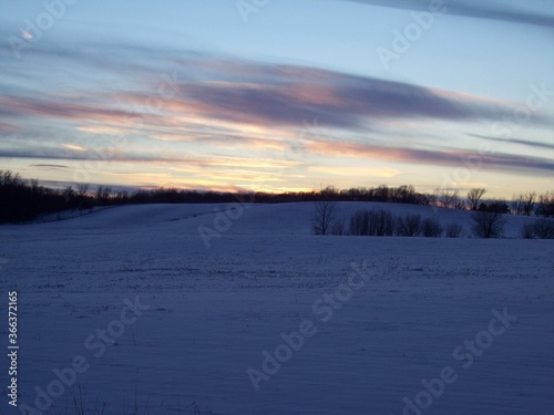 Rural Minnesota snowy fields at sunset 