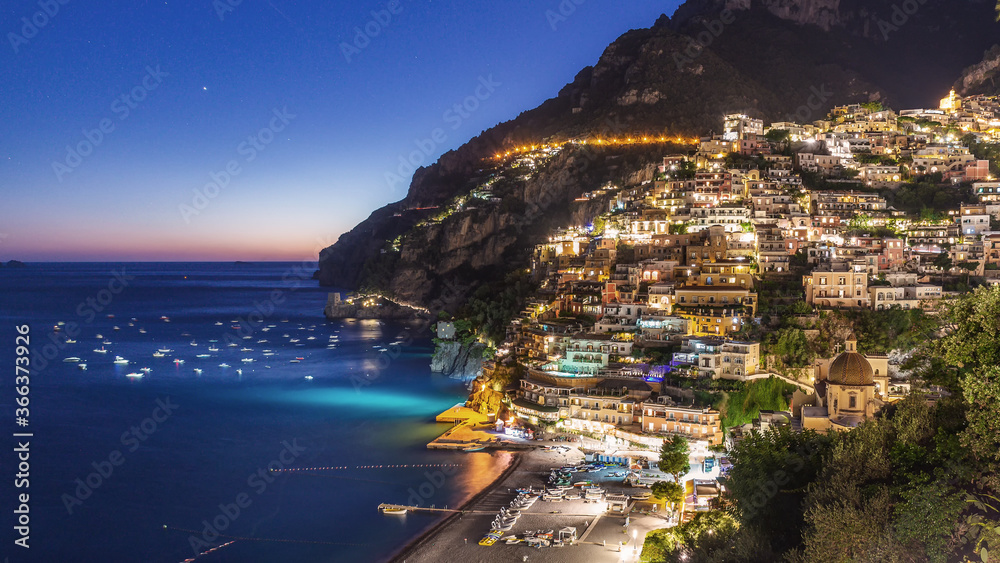 Blue hour after sunset in Positano with starry sky, Amalfi coast, Italy