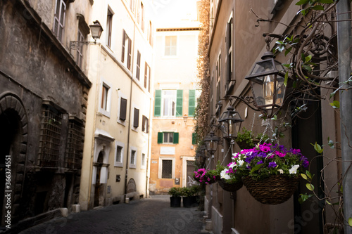 Fototapeta Naklejka Na Ścianę i Meble -  Flowered streets of Rome in summer