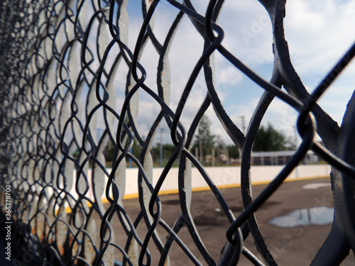 Mesh fencing of the sports field