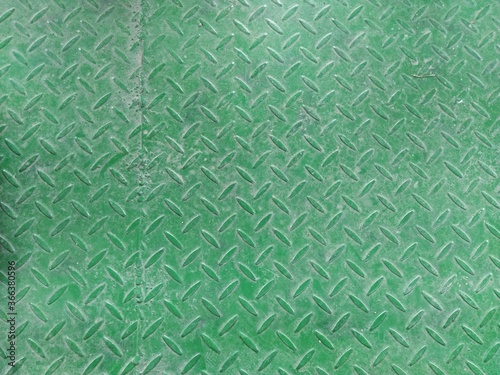 texture of fluted rusty iron metal plate background. Corrugated metal plate in green. Steel or iron metal profile. Close up photo