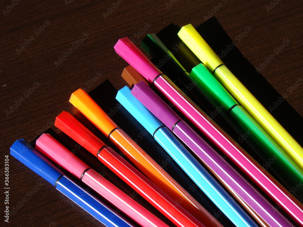 Fototapeta premium Colorful pens and pencils on a table