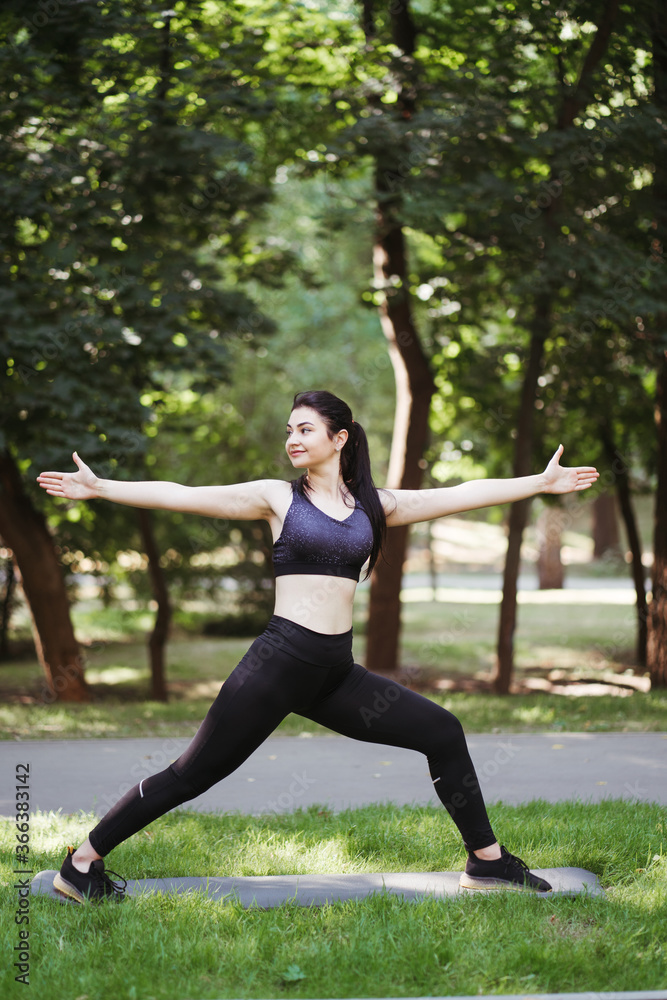 Yoga fitness lifestyle. Fit woman doing exercises in the park. Balance, body and mental health, self development Yoga fitness lifestyle. Fit woman doing exercises in the park. Balance, body and mental health, self development