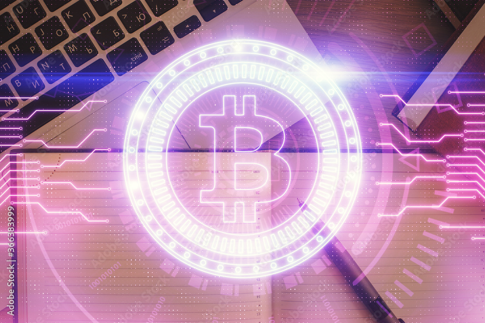 Obraz premium Blockchain theme hologram drawings over computer on the desktop background. Top view. Double exposure.