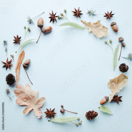 Hello autumn. Floral design greeting card. Fall yellow leaves and acorns wreath. Thanksgiving day, seasonal concept. Copy space.