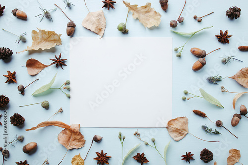 Hello autumn, thanksgiving day, DIY, holidays preparation and creativity layout. Festive decorations, dried leaves and white mockup greeting card, flat lay with empty space for text design