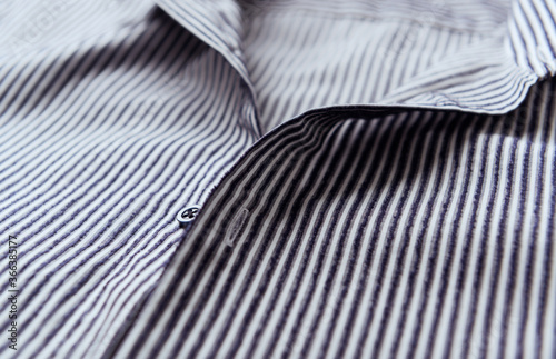 Close up of men's striped shirt.