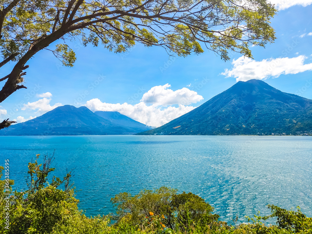 Blue Lake Atitlan surrounded by Volcanoes in Guatemala
