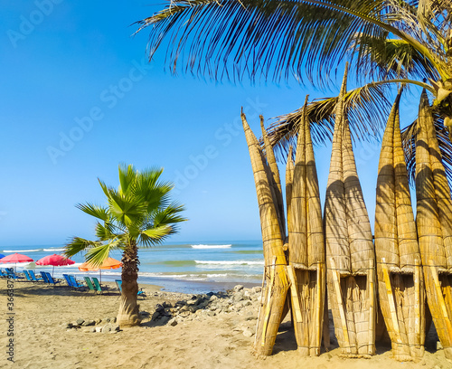Traditional reed boats in the city of Huanchaco in Peru photo