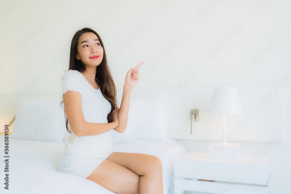 Portrait beautiful young asian woman relax happy smile on bed with white pillow blanket Portrait beautiful young asian woman relax happy smile on bed with white pillow blanket