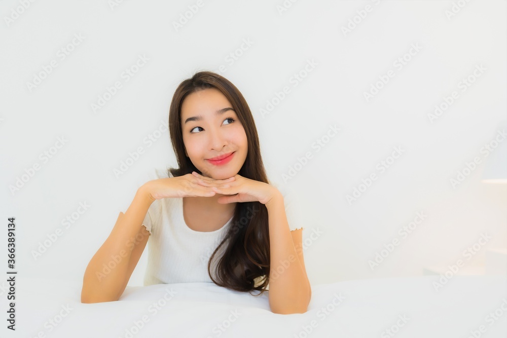 Portrait beautiful young asian woman relax happy smile on bed with white pillow blanket Portrait beautiful young asian woman relax happy smile on bed with white pillow blanket