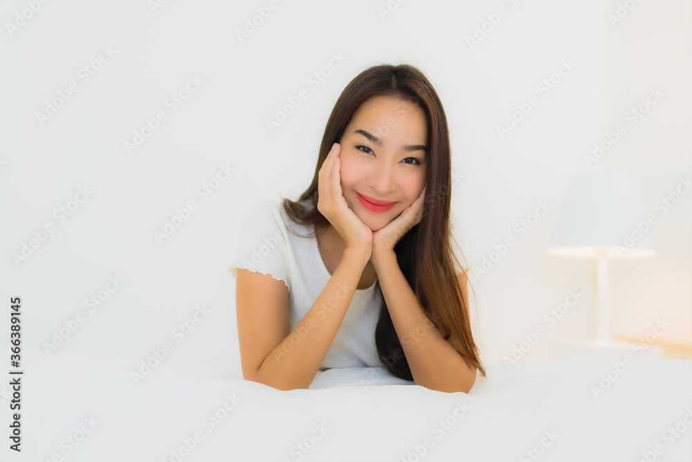 Portrait beautiful young asian woman relax happy smile on bed with white pillow blanket Portrait beautiful young asian woman relax happy smile on bed with white pillow blanket