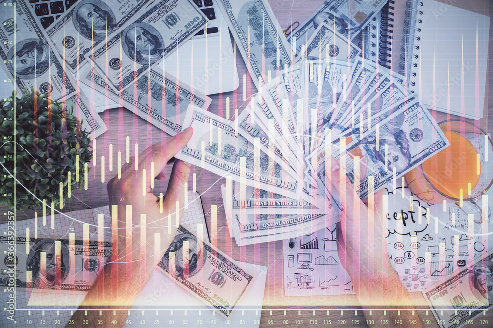 Multi exposure of financial graph drawing hologram and USA dollars bills and man hands. Analysis concept. Multi exposure of financial graph drawing hologram and USA dollars bills and man hands. Analysis concept.