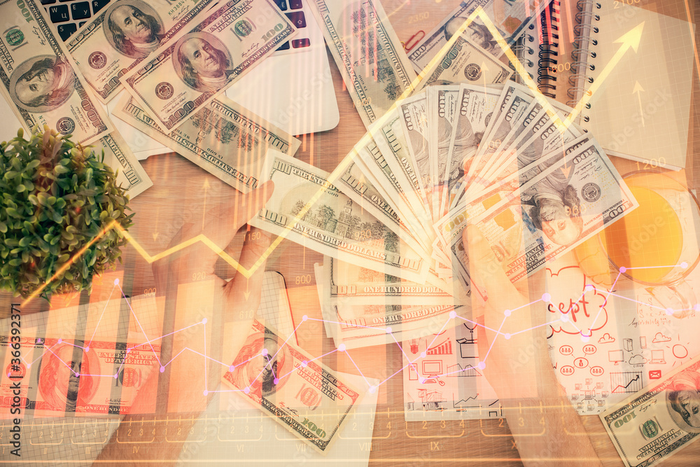 Multi exposure of financial graph drawing hologram and USA dollars bills and man hands. Analysis concept. Multi exposure of financial graph drawing hologram and USA dollars bills and man hands. Analysis concept.