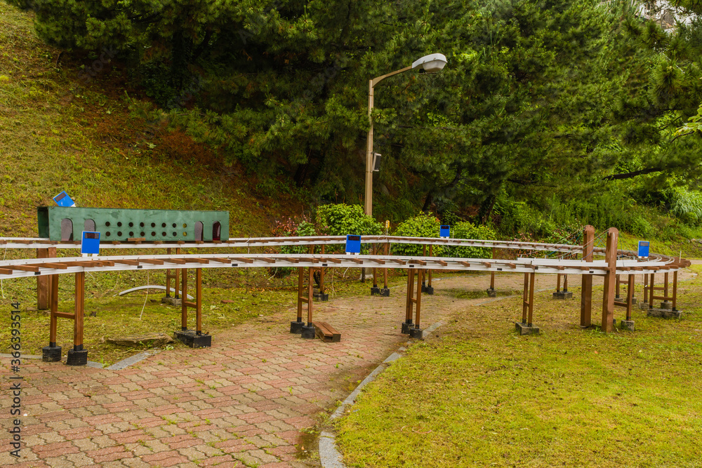 Model train track with buildings and tunnels Model train track with buildings and tunnels