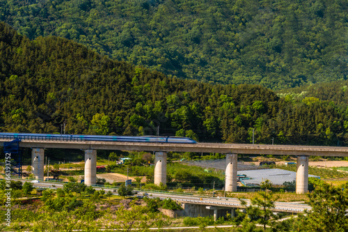 High speed train in rural countryside.