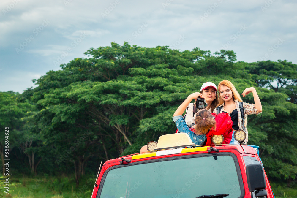 Group of happy traveler on hiking car.  Summer vacation. Travelling, hiking
