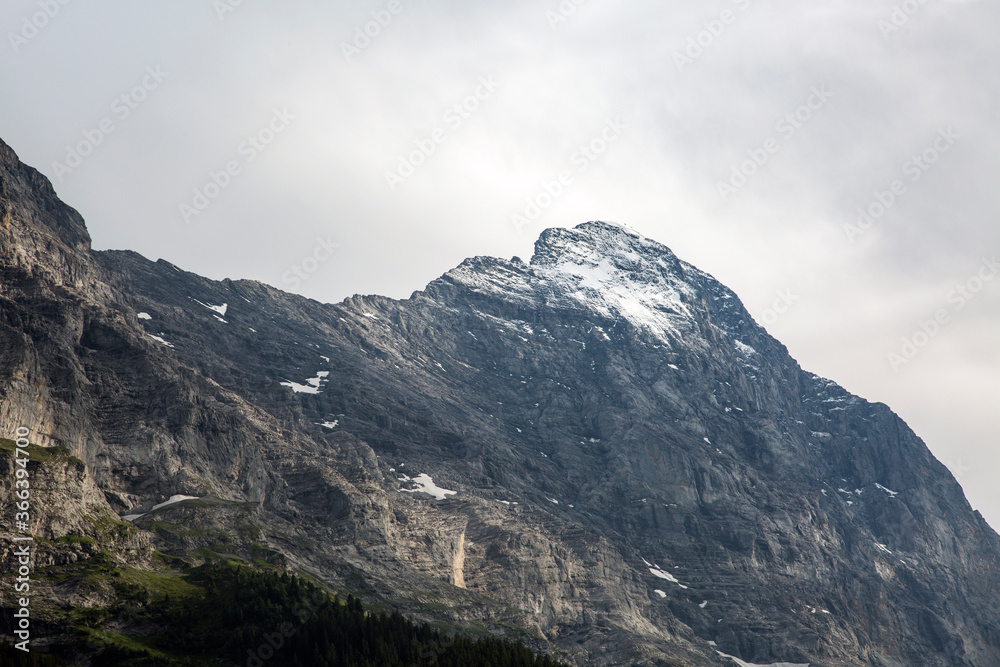 the North face of the Eiger mountain in a snow, Bernese Alps, Grindelwald, Switzerland the North face of the Eiger mountain in a snow, Bernese Alps, Grindelwald, Switzerland