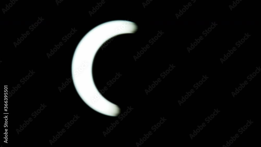 solar eclipse in the Dubai desert. almost anular phase, full of the eclipse. rack focus showing the eclipse. tight details 1200mm lens f4 partial total annular solar eclipse in the Dubai desert. almost anular phase, full of the eclipse. rack focus showing the eclipse. tight details 1200mm lens f4 partial total annular