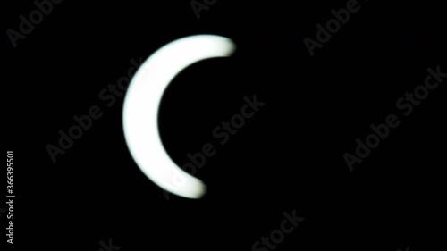 solar eclipse in the Dubai desert. almost anular phase, full of the eclipse. rack focus showing the eclipse. tight details 1200mm lens f4  partial total annular photo