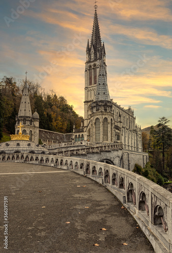 View of the cathedral in Lourdes, France at sunset