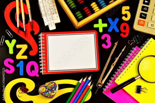 School stationery frame, student Desk, back to school. Opportunity to learn new knowledge and education. Notebooks, pencils and pens for writing and drawing, abacus for mathematics.