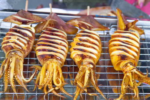  grilled squid place on the grill