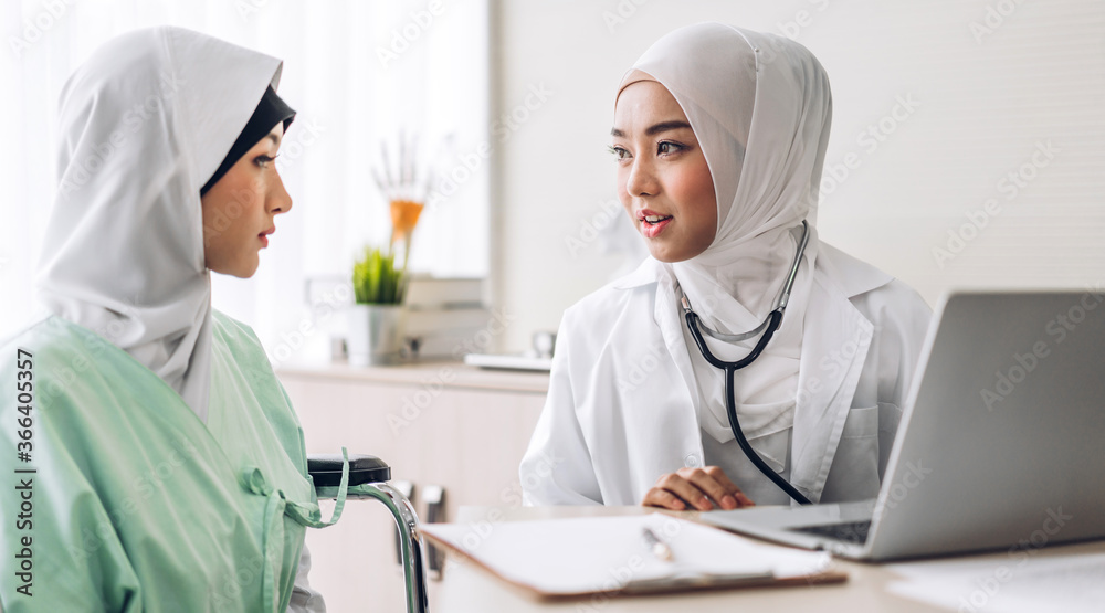 Muslim asian woman doctor service help support discussing and consulting talk to muslim woman patient and check up information at meeting health medical care express trust concept in hospital Muslim asian woman doctor service help support discussing and consulting talk to muslim woman patient and check up information at meeting health medical care express trust concept in hospital