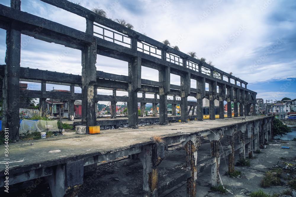 Old industrial ruins building - Agenna Shipyard Ruins with afternoon cloudy sky , shot in Zhongzheng District, Keelung, Taiwan.