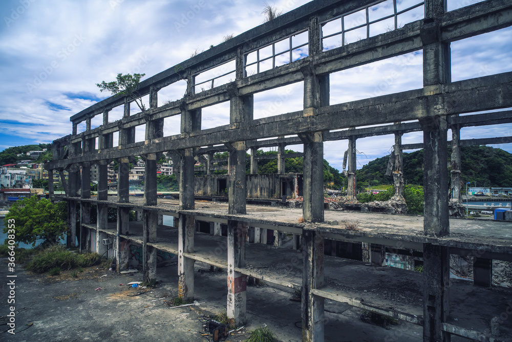 Old industrial ruins building - Agenna Shipyard Ruins with afternoon cloudy sky , shot in Zhongzheng District, Keelung, Taiwan.