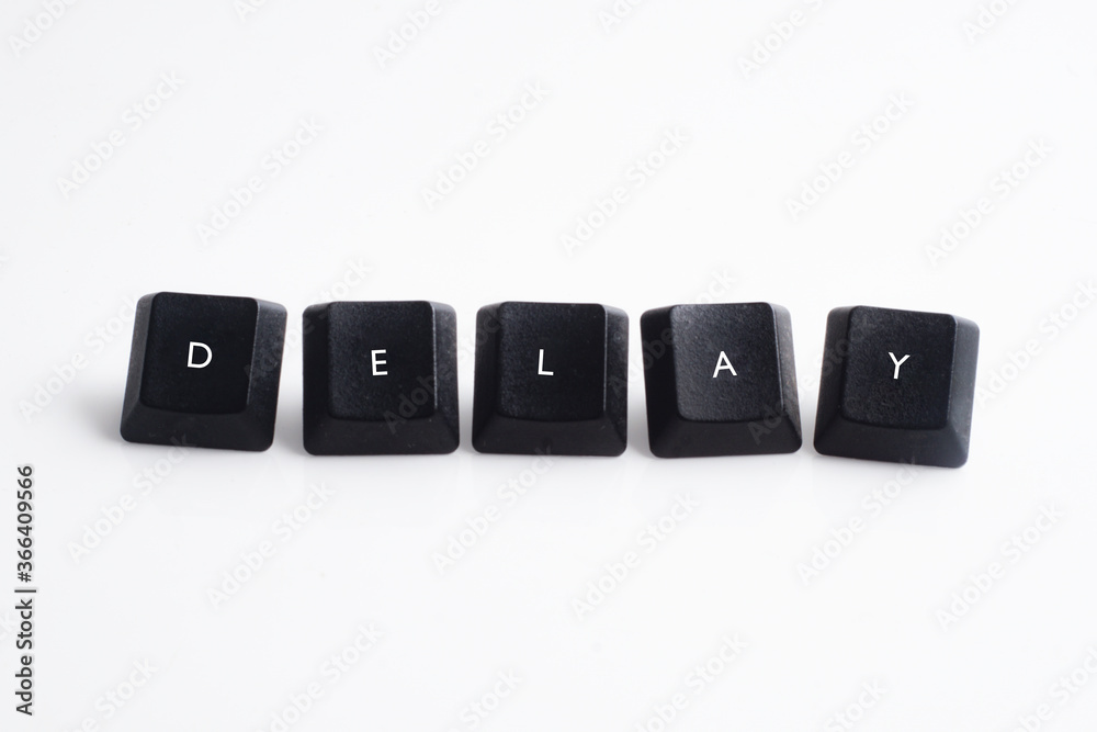 Delay word on black cube with white background