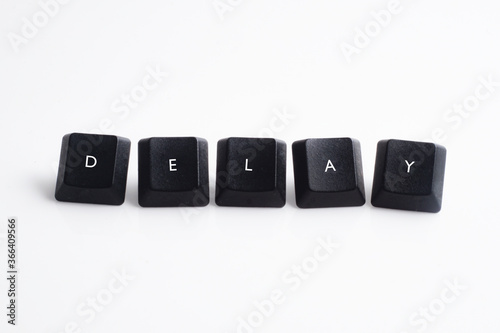 Delay word on black cube with white background