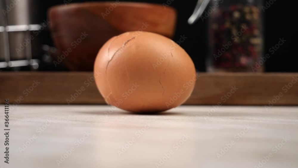 Falling boiled egg onto kitchen table