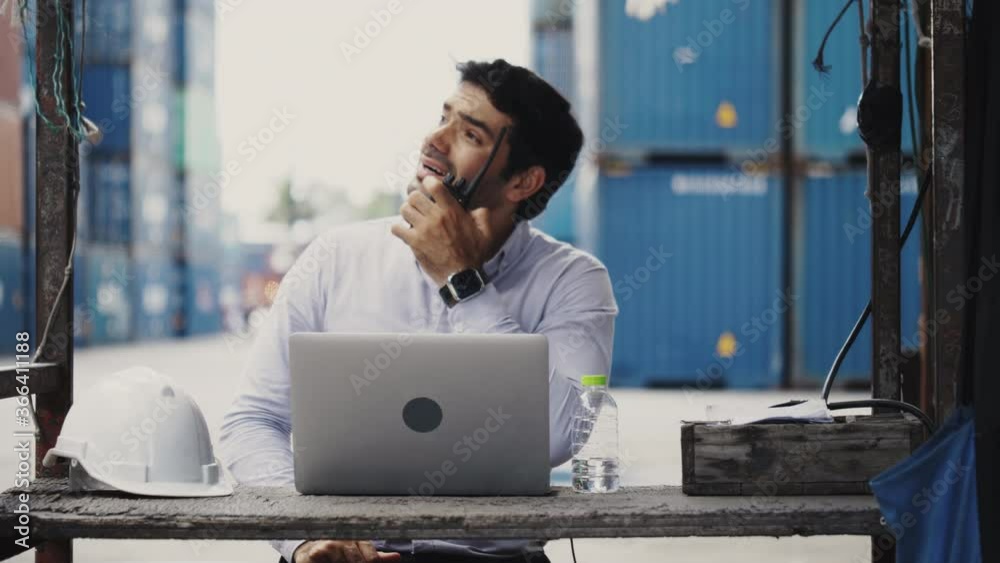 Engineer or businessmen are video call consult with friend via laptop on the construction site Or warehouse. Hard hat Safety protection while working in the factory. Concept Communication technology