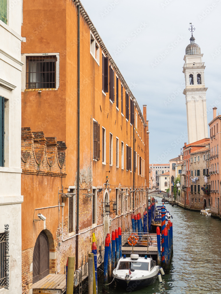 Venezia, Italy. View of the city canals and the crooked or leaning bell tower. Venezia best of Italy and one of the most famous cities in the world. Tourist destination