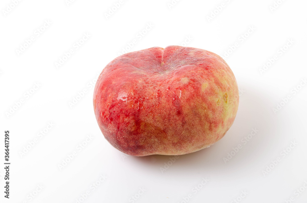 One bright, juicy peach on a white background. Fig peach in close-up on a white background one on one. Water drops on a peach, dew in close-up One bright, juicy peach on a white background. Fig peach in close-up on a white background one on one. Water drops on a peach, dew in close-up