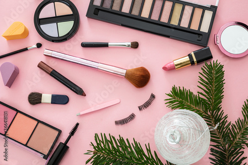 Make up xmas cosmetics products against pink color background