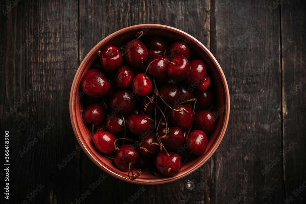 Freshly harvested cherries bowl. Selective focus. Shallow depth of field. Freshly harvested cherries bowl. Selective focus. Shallow depth of field.