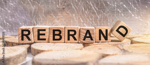 Wooden blocks with the word Rebrand. Business and finance concept.